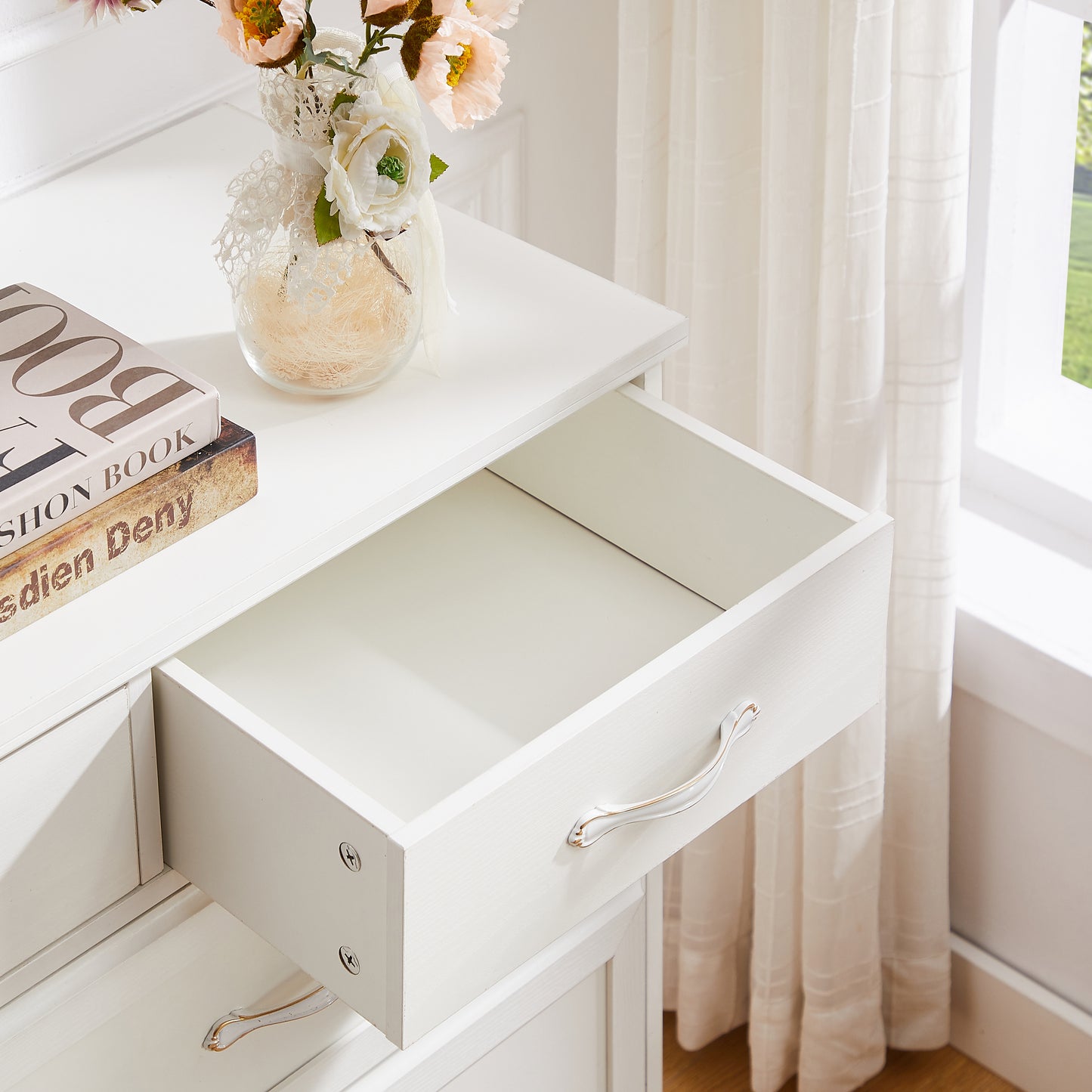 White wooden dresser with 9 drawers